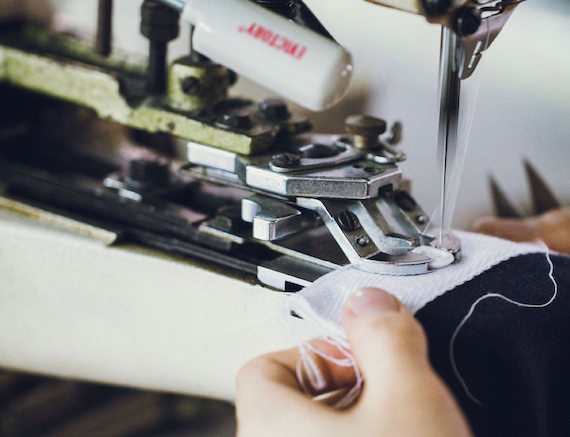 A person inspecting sewing quality