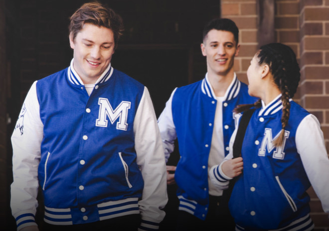 High School Students wearing custom varsity jackets